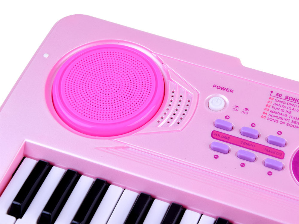 Elektrinis pianinas su mikrofonu ir šviečiančiais klavišais, rožinis