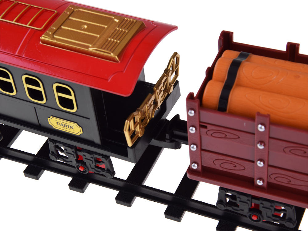 Elektrinis vaikiškas traukinys su geležinkelio bėgiais, garais ir šviesa