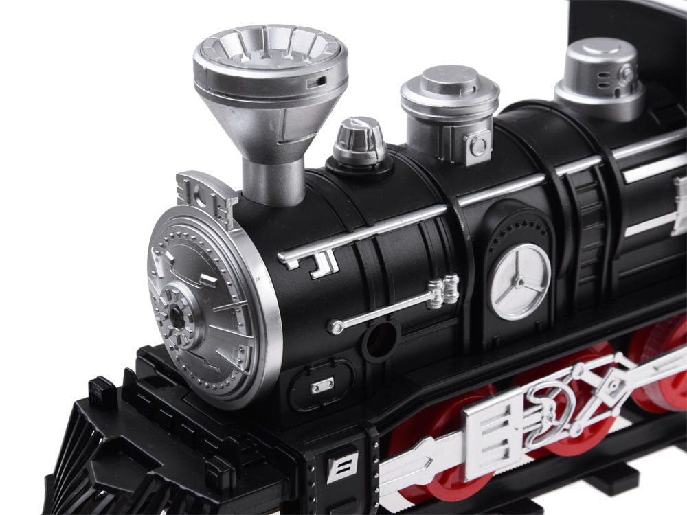 Elektrinis vaikiškas traukinys su geležinkelio bėgiais, garais ir šviesa