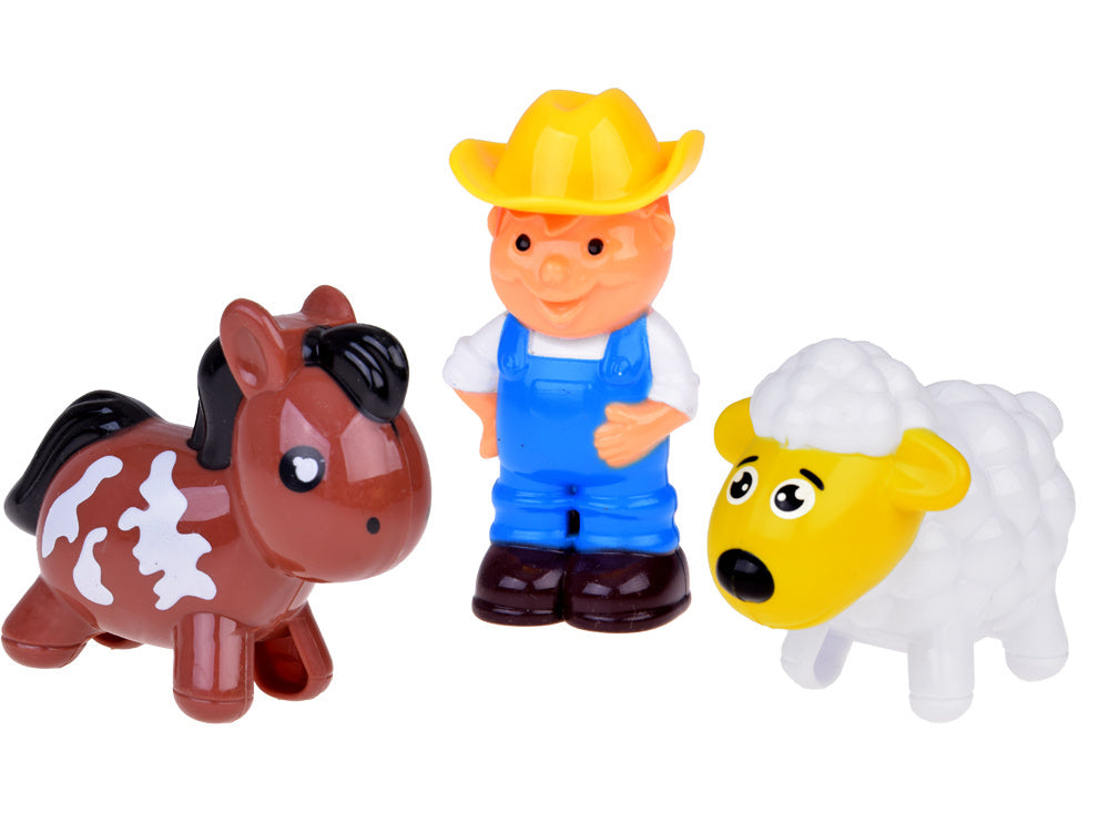 Ūkininko traktorius su priekaba ir gyvūnais