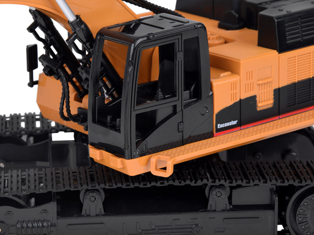 Nuotoliniu būdu valdomas vikšrinis ekskavatorius su dūmų efektu, geltonas