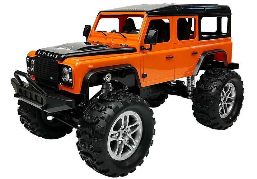 Nuotoliniu būdu valdomas visureigis 4x4 „Land Rover Defender“, oranžinis