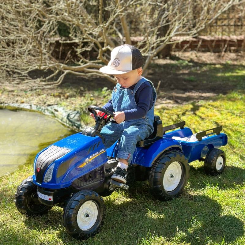 Minamas traktorius su priekaba New Holland Large Falk, mėlynas