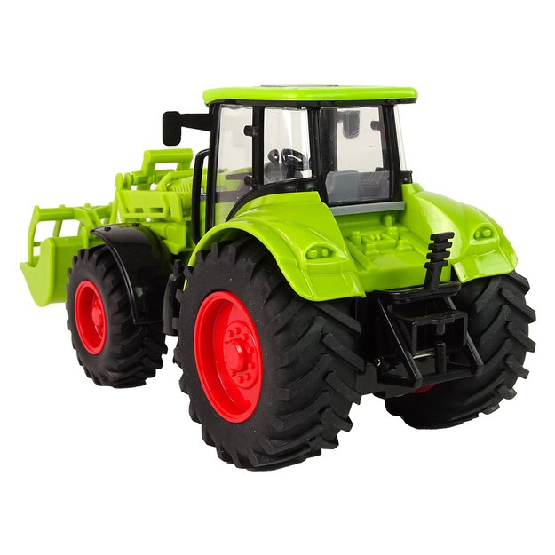 Didelis traktorius su frikcine pavara, žalias