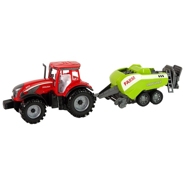 Raudonas traktorius su sėjamąja 