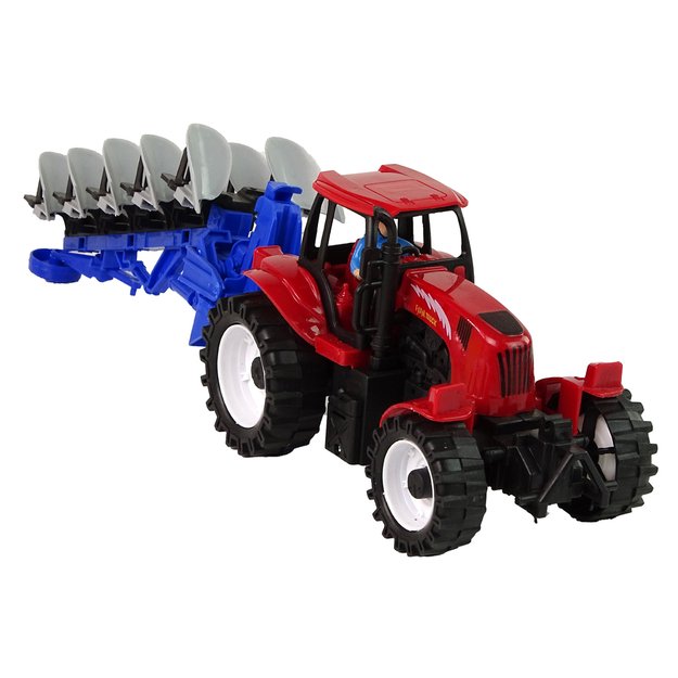 Žaislinis raudonas traktorius su mėlynu plūgu